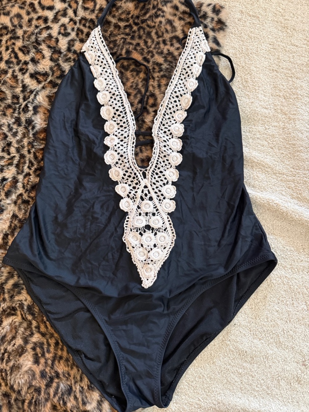 Kona Sol Black One-Piece Swimsuit with Cream Crochet Plunge